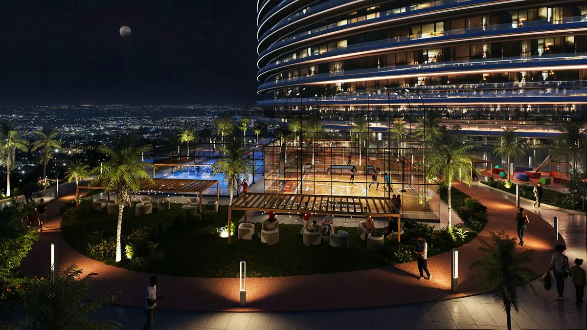 Sports courts, gardens and a pool at Skyflame, lit at night, developer render