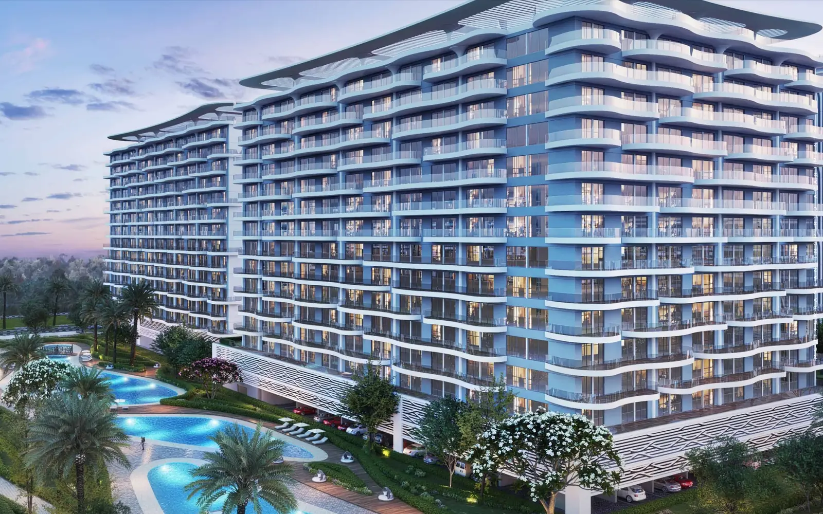 Lagoon Views apartment towers at DAMAC Lagoons at dusk, with pools and palms, developer render