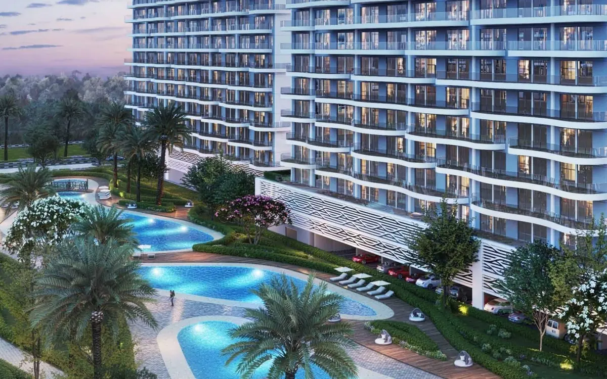 Pools, palms and gardens at the foot of the Lagoon Views towers, DAMAC Lagoons, developer render